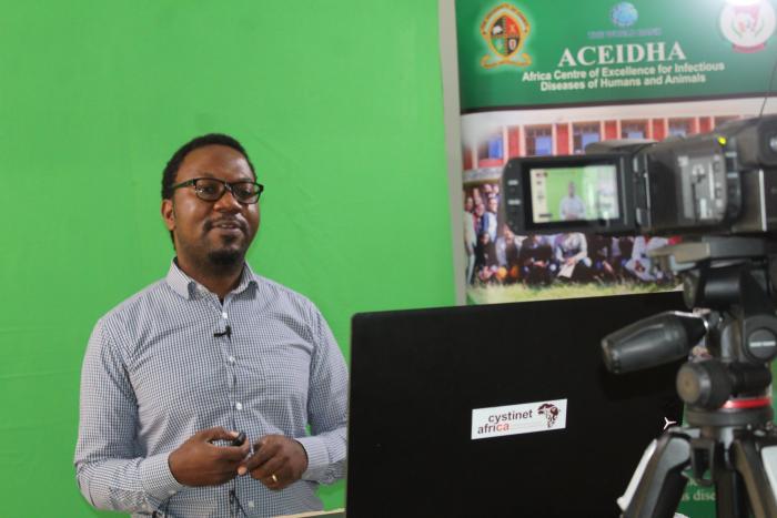 Dr. Andrew during a presentation of a lecture.